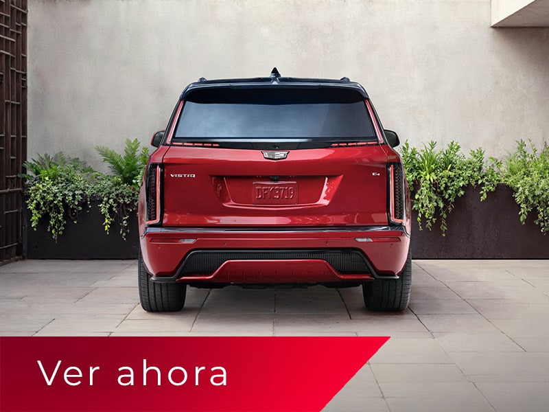 Vista trasera de una VISTIQ 2027 en Rojo estacionada en una entrada de concreto